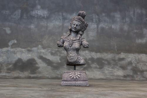 Decorative cement relief on a stand with Hindu goddess Dewi Sri carving.