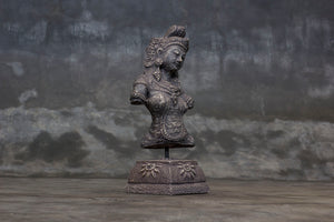 Decorative cement relief on a stand with Hindu goddess Dewi Sri carving.