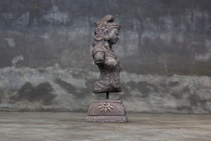 Decorative cement relief on a stand with Hindu goddess Dewi Sri carving.