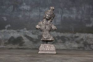 Decorative cement relief on a stand with Hindu goddess Dewi Sri carving.