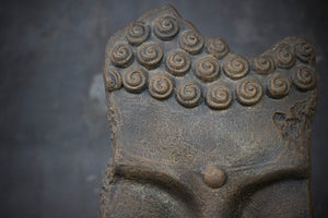 Mask-Shaped Buddha Sculpture on a Stand