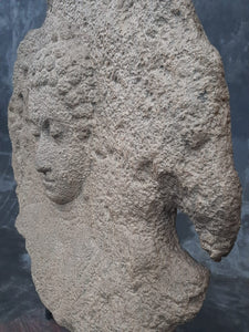 Decorative Stone Circle with Buddha Head Carving